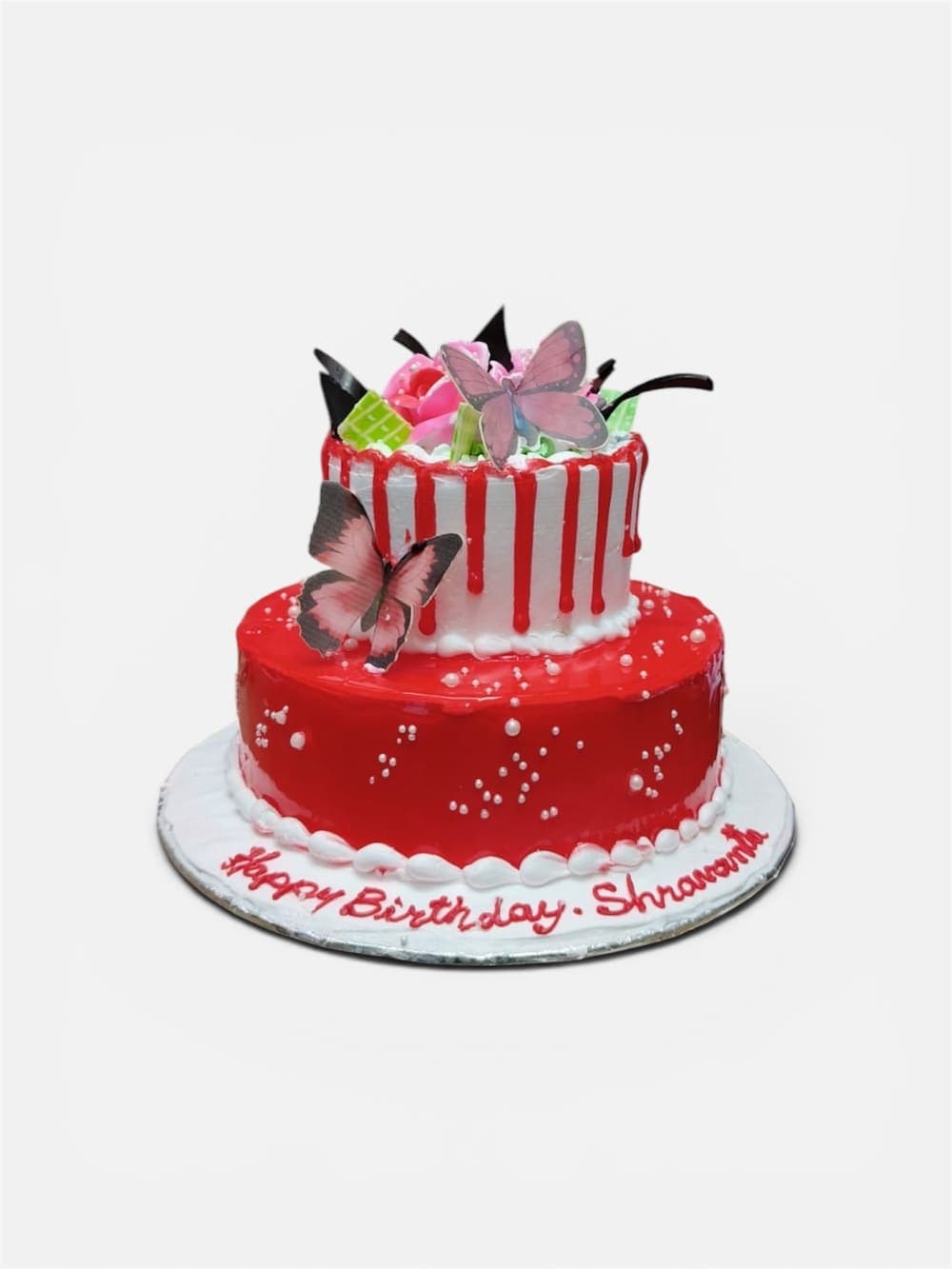 Two-tier birthday cake with piped name